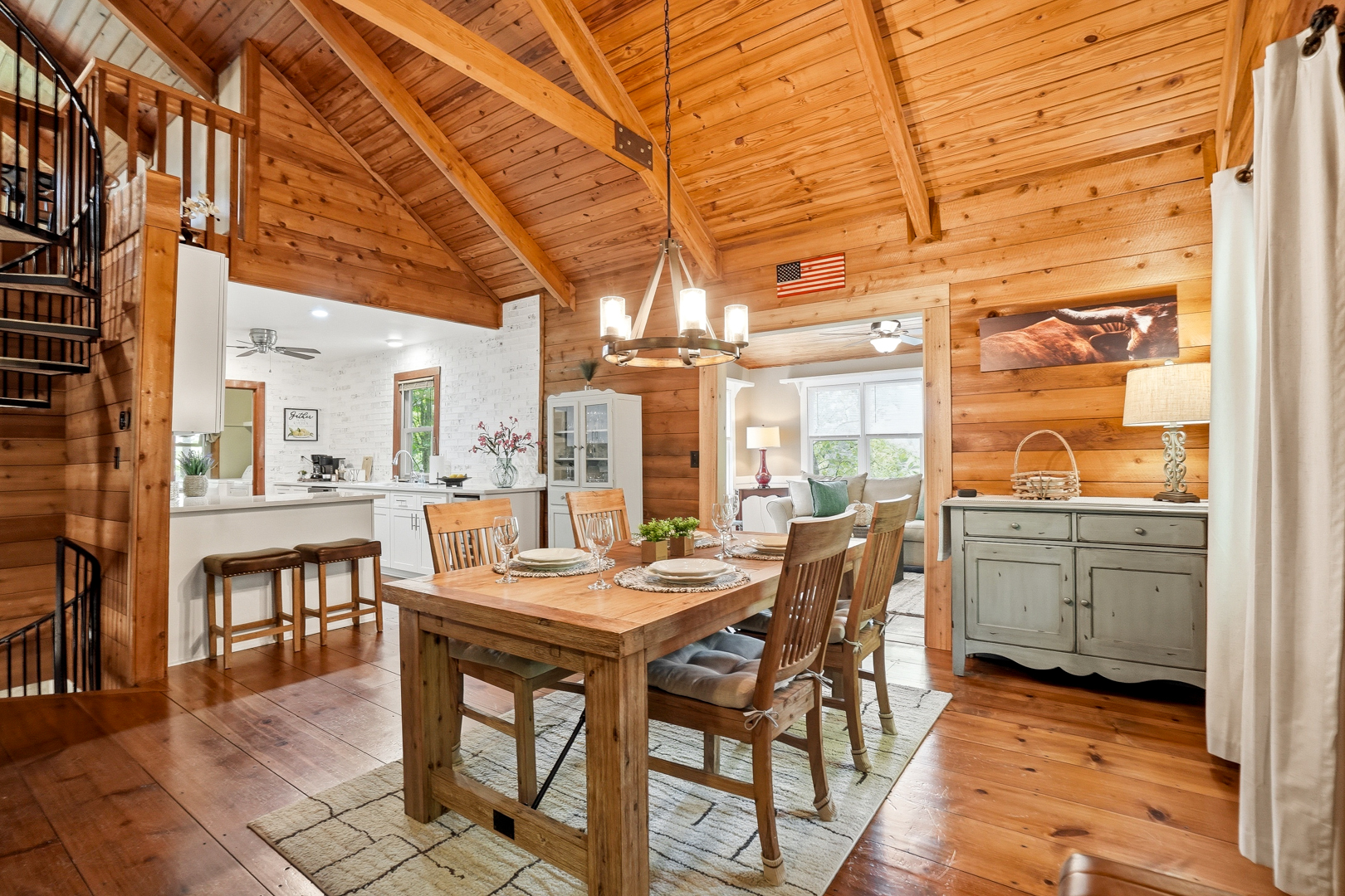 Dining table with the white kitchen beyond