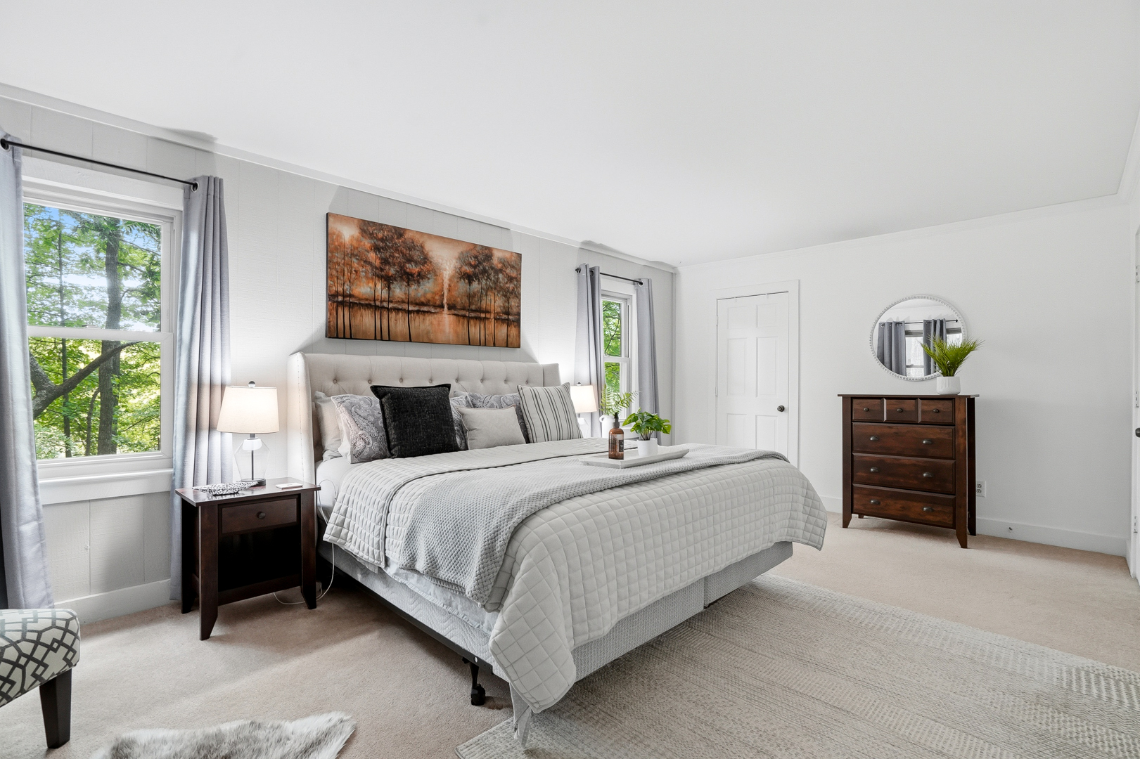 King suite with upholstered bed on the main level