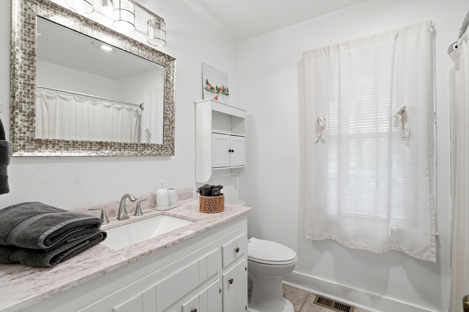 Second full bathroom with tub and shower