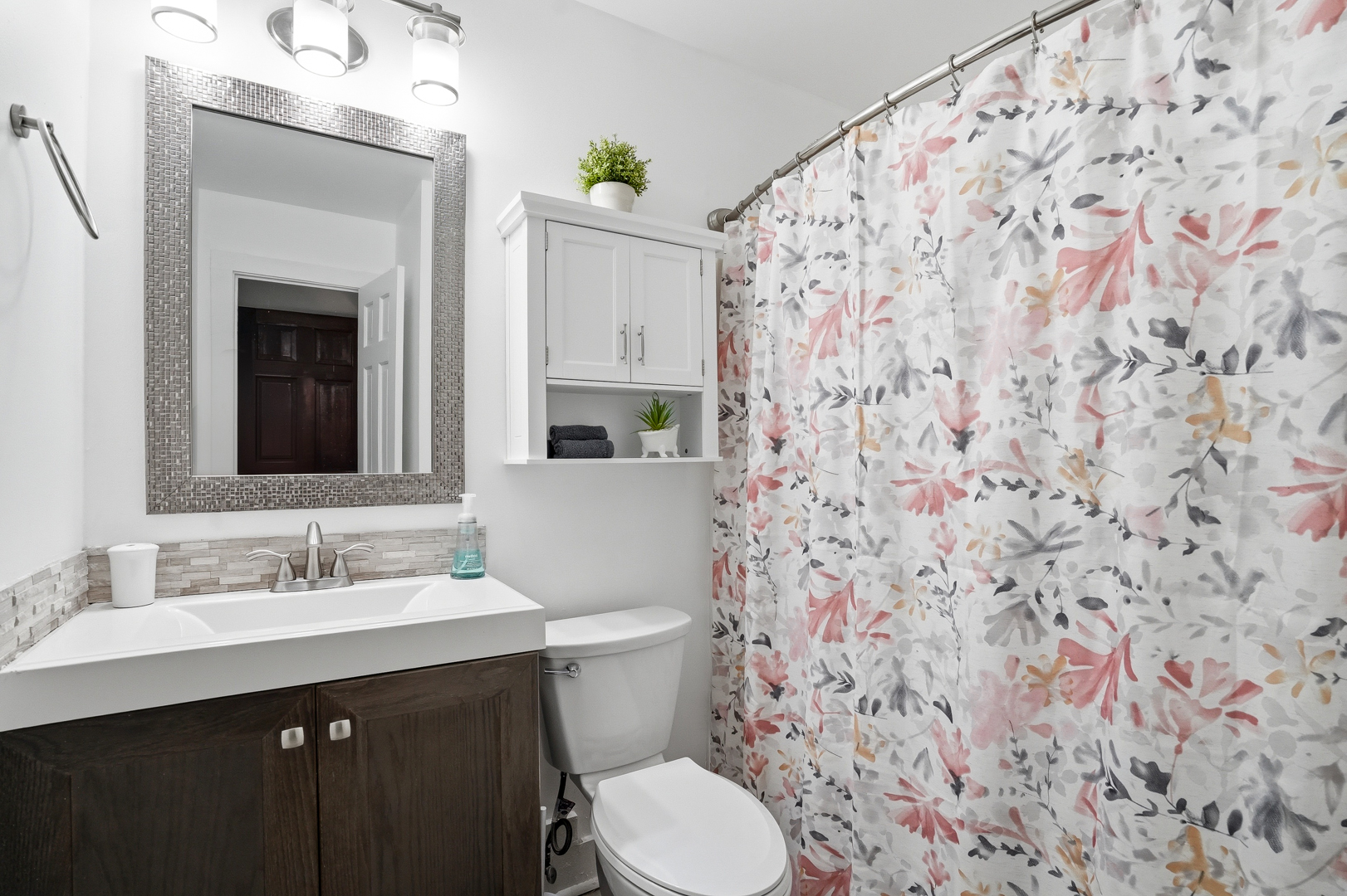 Full bathroom with shower and vanity