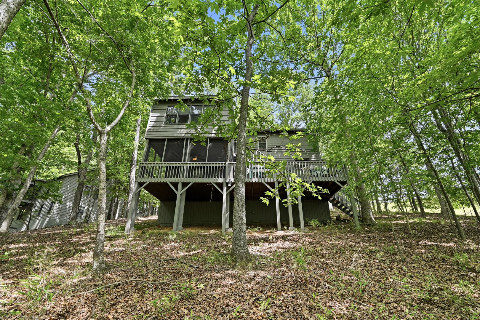 Cabin exterior nestled among the trees