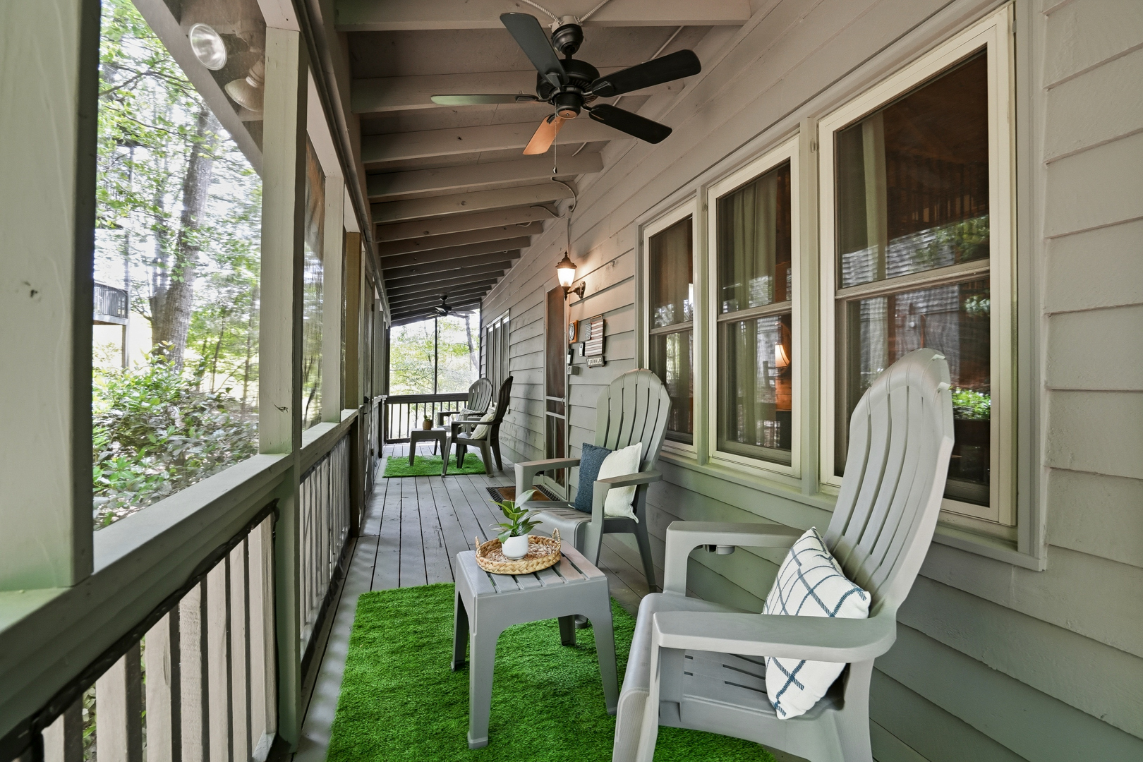 Covered porch with Adirondack chairs